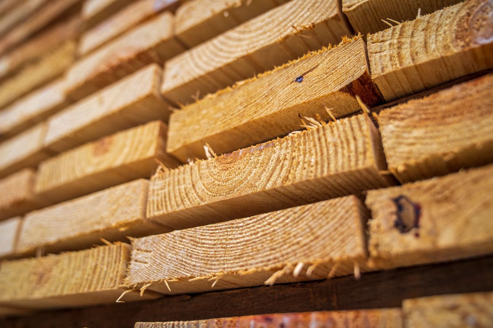 Close view of sawn softwood battens stacked end on.